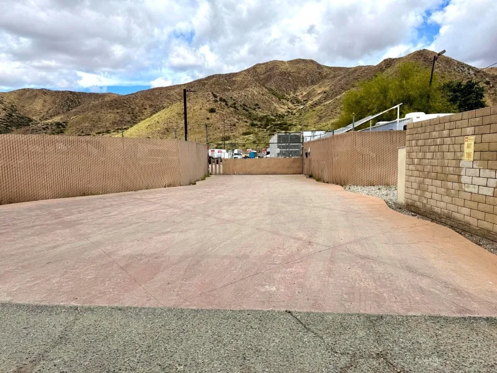 Secure outdoor commercial storage yard with fencing and paved staging area in Santa Clarita
