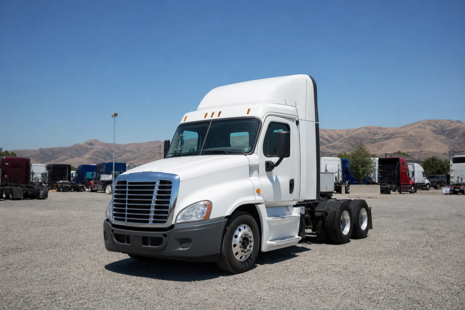 White bobtail semi-truck tractor parked in a spacious outdoor storage space at the Santa Clarita facility